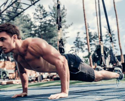 Man doing a press up outside