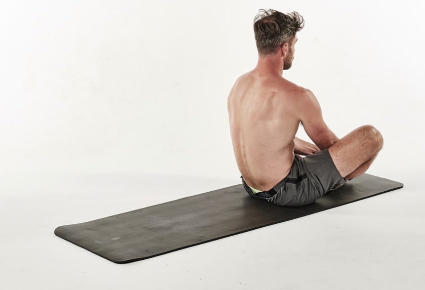 man demonstrating a butterfly sit-up