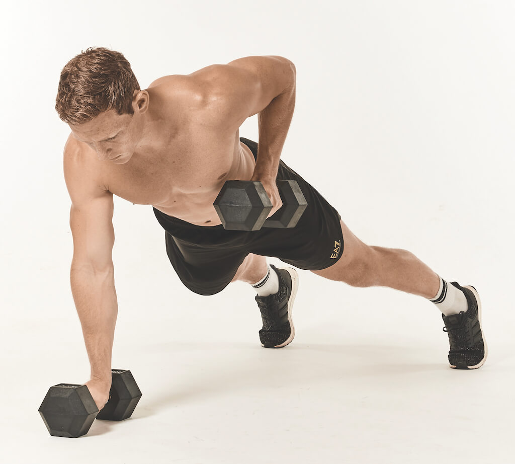 Man performing a push-up with renegade row