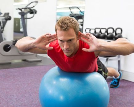 Man exercising on a gym ball