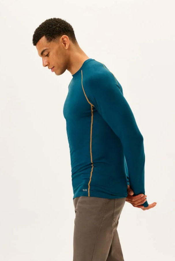 A man wearing the BAM Novea baselayer