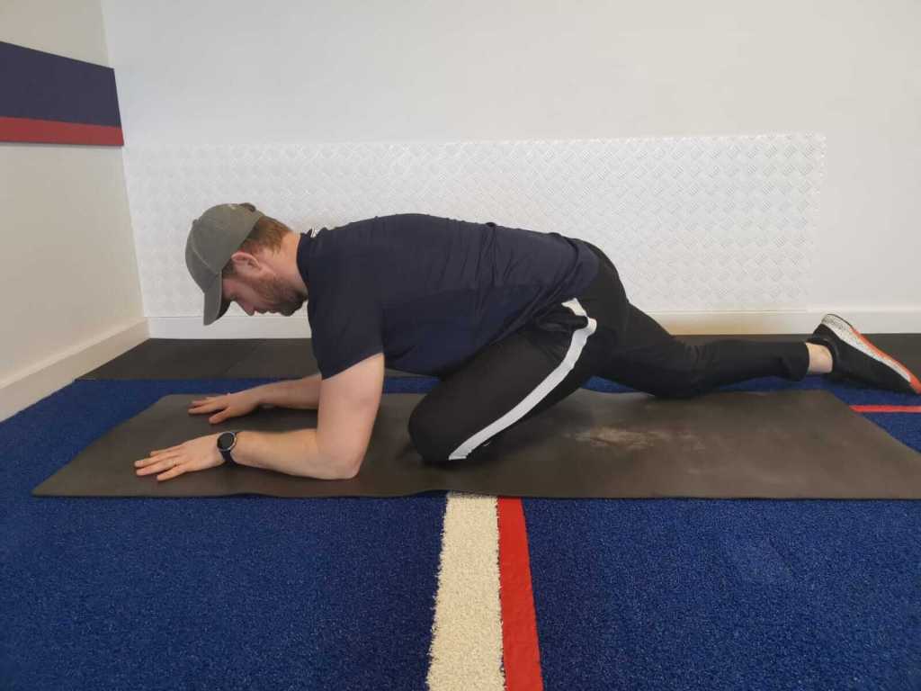 Man performing a pigeon pose