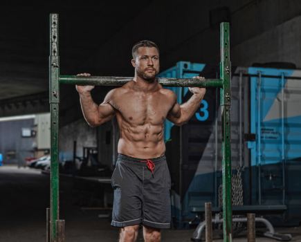 man performing strongman exercise