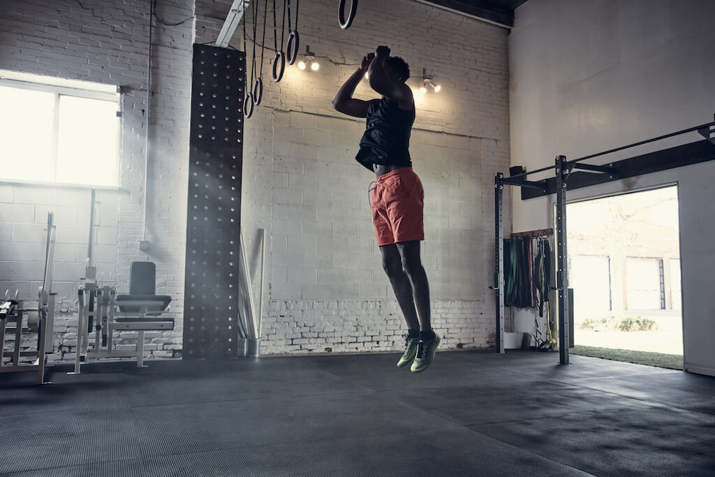 Man performing the HYROX Burpee Broad Jump