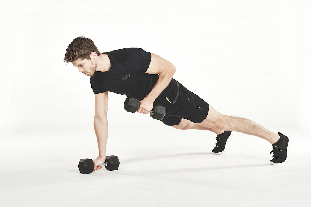 man performs Dumbbell Press-Up to Renegade Row in workout to burn fat fast