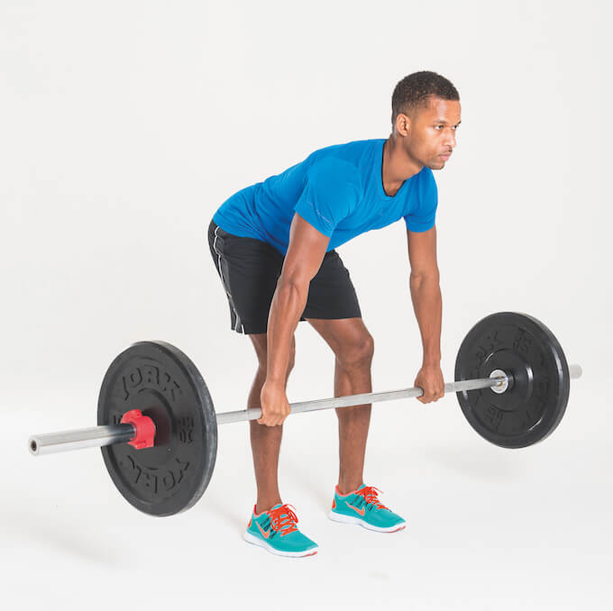 man performing barbell bent-over row