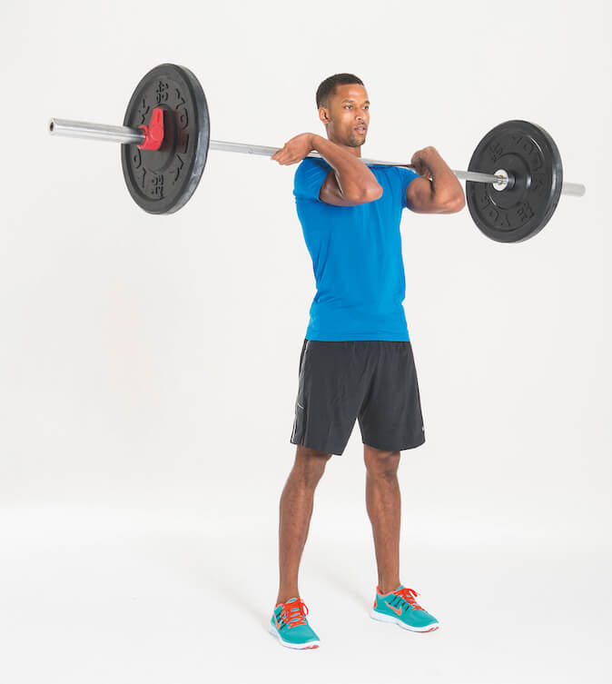 man performing barbell hang squat clean