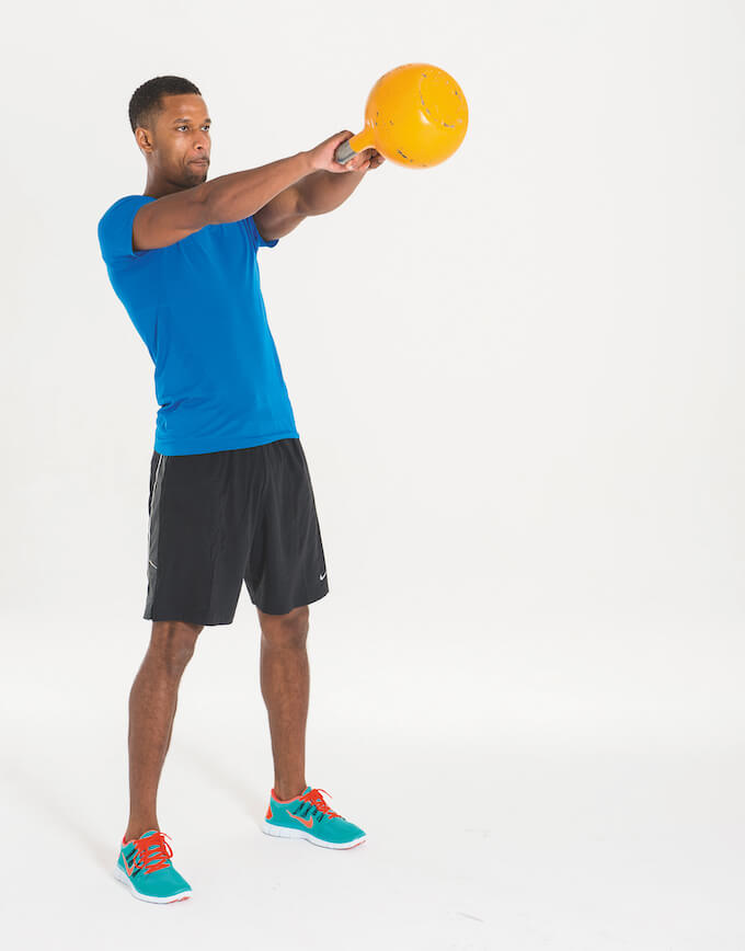 man performing kettlebell swing