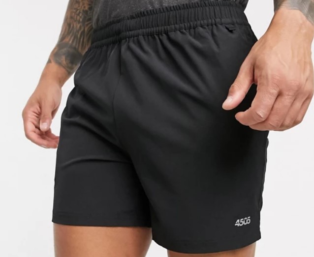 A man from waist to above the knees, wear a pair of ASOS 4505 Icon 7in Training Shorts – one of the best 7-inch inseam shortss