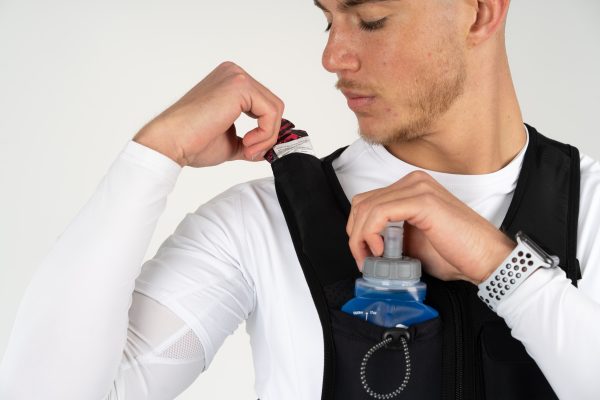 Man adjusting the Freetrain Hydro 1 Vest