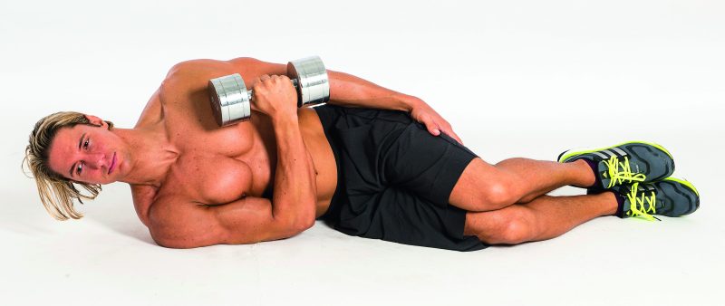 Man performing dumbbell internal rotation