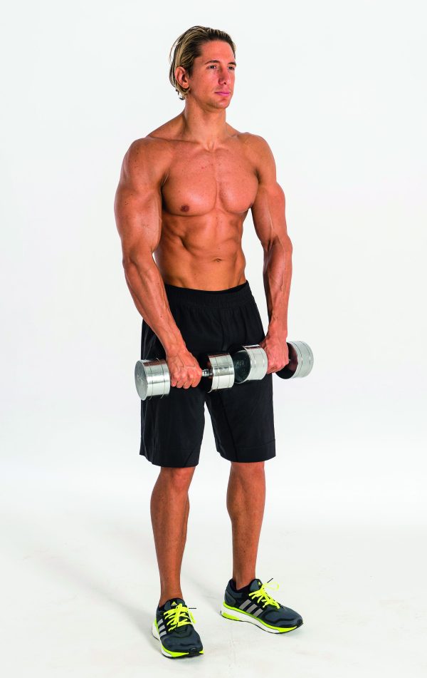 Man performing dumbbell front raise