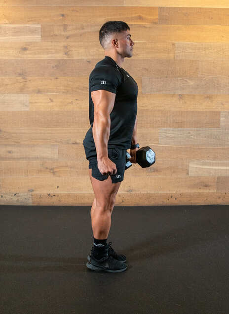 man demonstrates single leg deadlift, starting standing with a weight in one hand