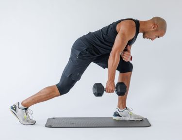 Man performing start of single arm row