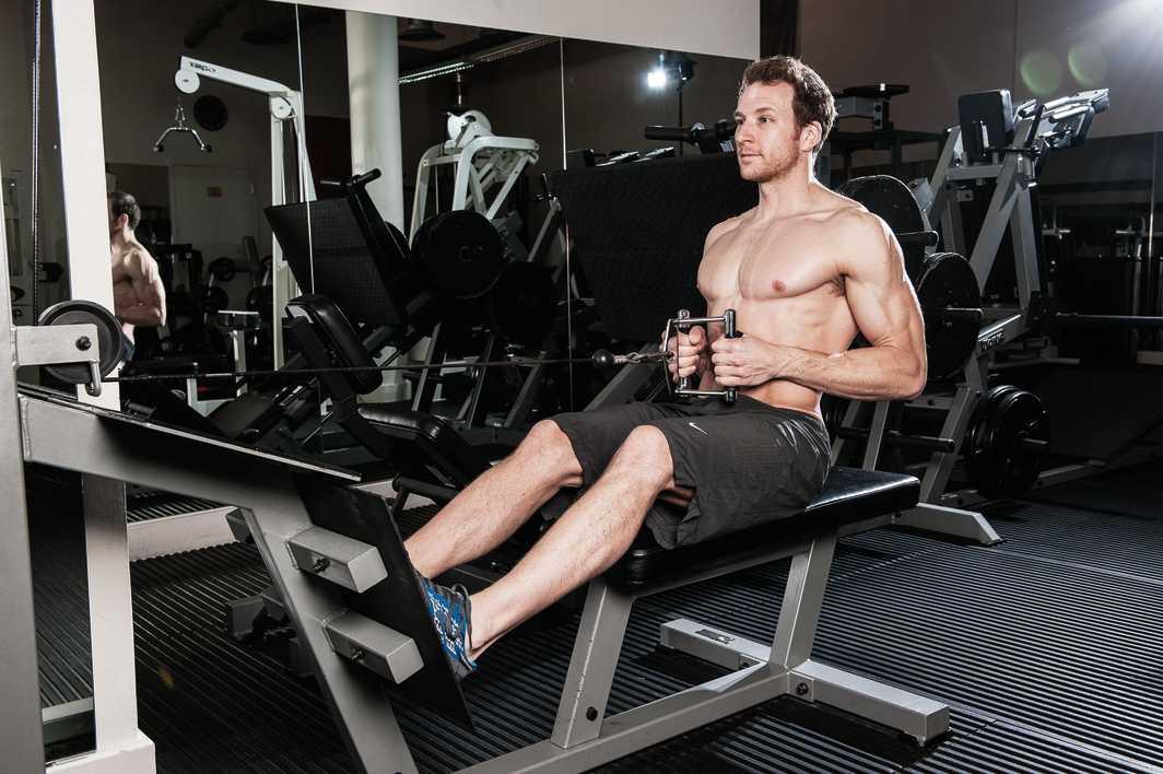 man demonstrates how to do a seated cable row