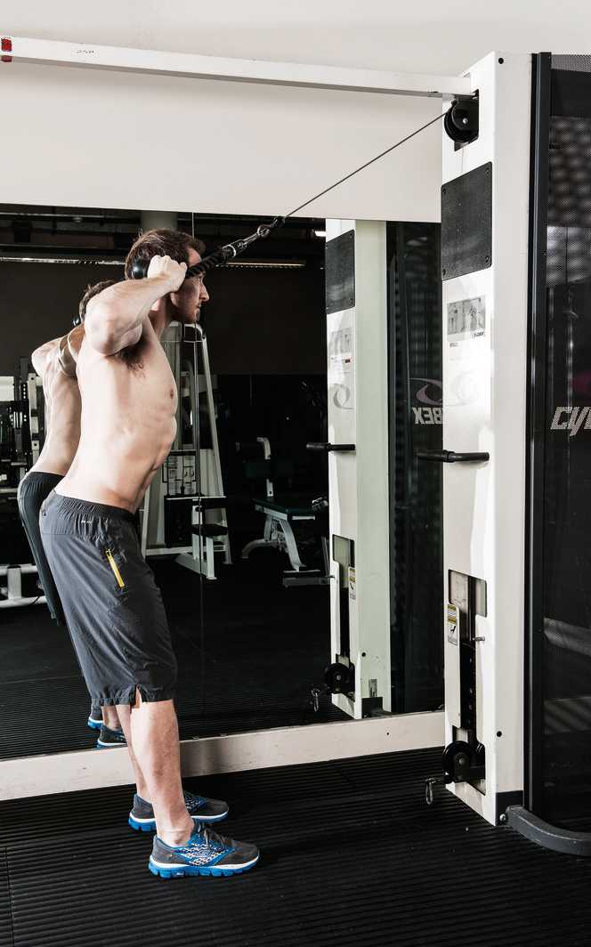 man demonstrates rope face pull to build back muscles