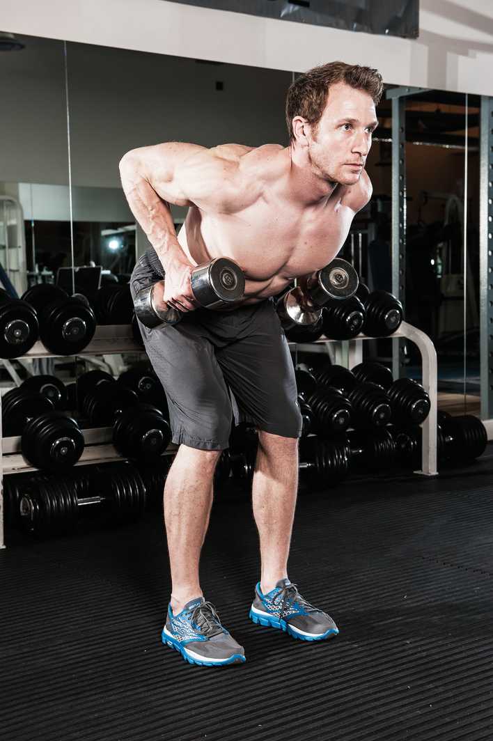 man demonstrates how to build back muscles with dumbbell bent over rows