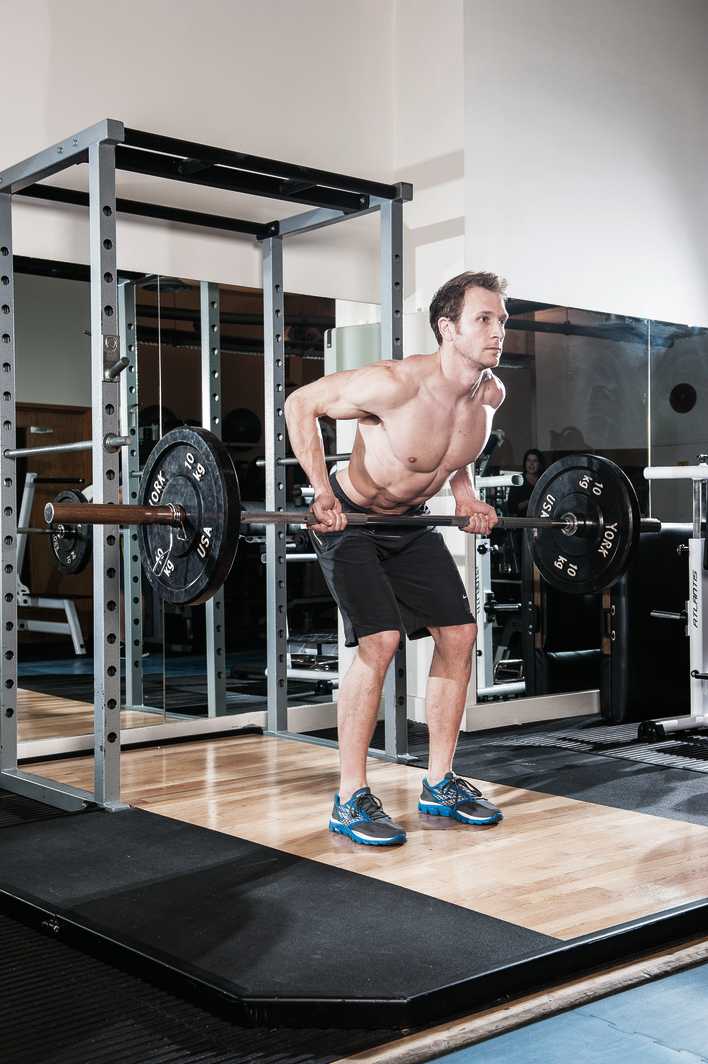 man demonstrates how to do a reverse grip row