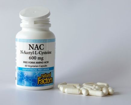 An open bottle of NAC tablets