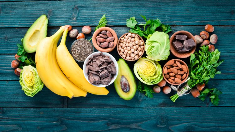 A selection of fruit, nuts and legumes on a table