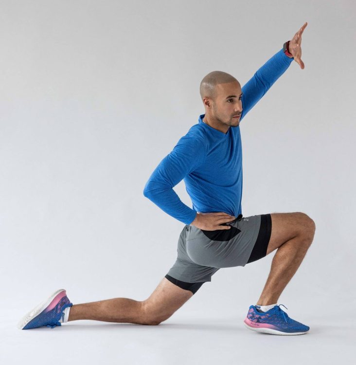 Man performing end of a lunge hip flexor stretch - best hip stretches