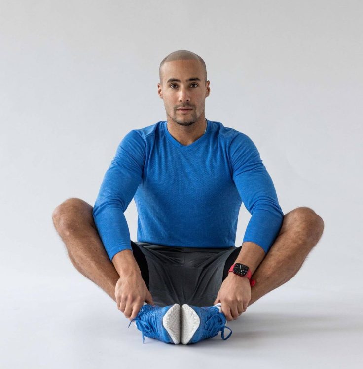 Man performing a butterfly stretch