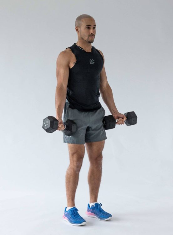 Man performing a Zottman curl - best dumbbell forearm exercises