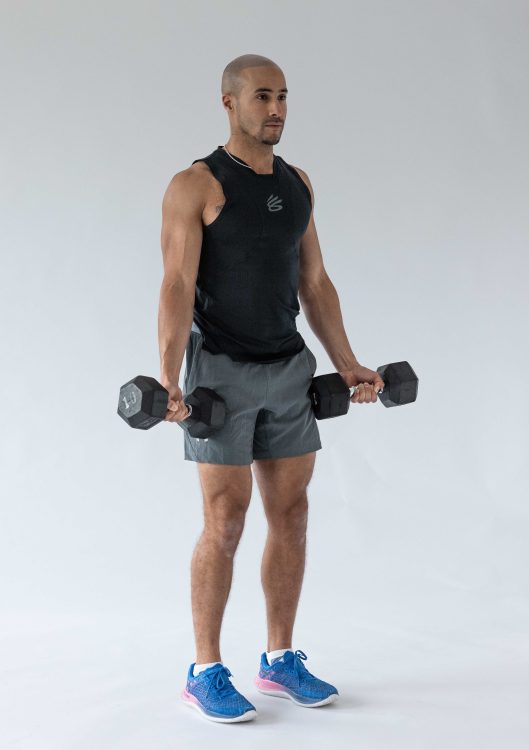 Man performing a Zotman curl - best dumbbell forearm exercises