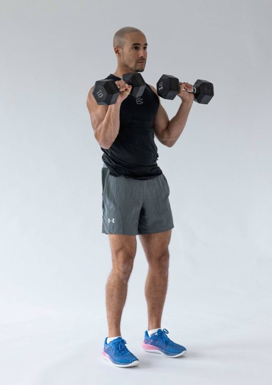 Man performing end of a Zottman curl - best dumbbell forearm exercises