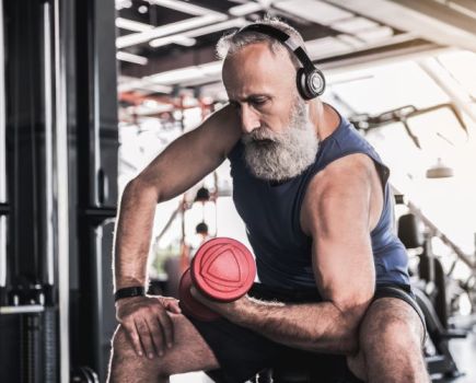 Senior man lifting a dumbbell