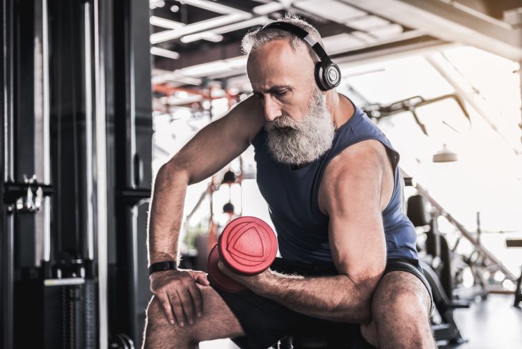 Senior man lifting a dumbbell