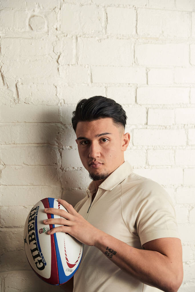 Marcus Smith holds rugby ball