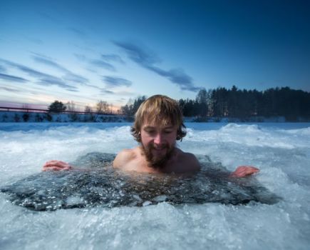 Man plunging into hole in frozen lake