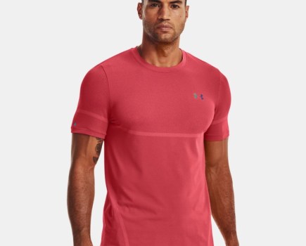 A man wearing a red UA Rush Legacy tee