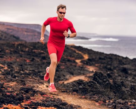 A trail runner wearing compression clothing