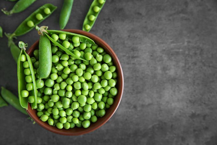 Overhead shot of a bowl of green peas