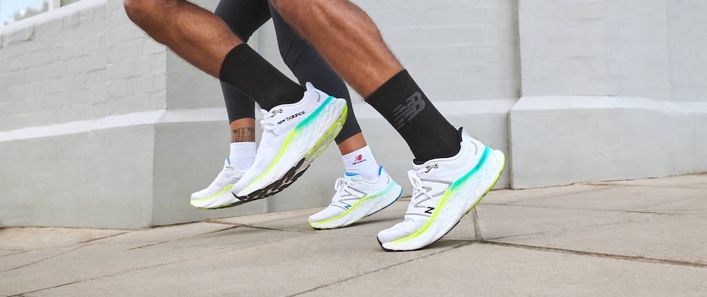 Feet of runners wearing New Balance Fresh Foam X More v4 running shoes