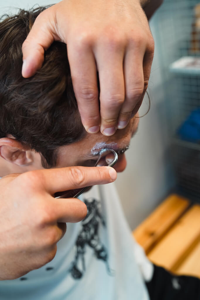 Man using The Scar Wand on his facial scar