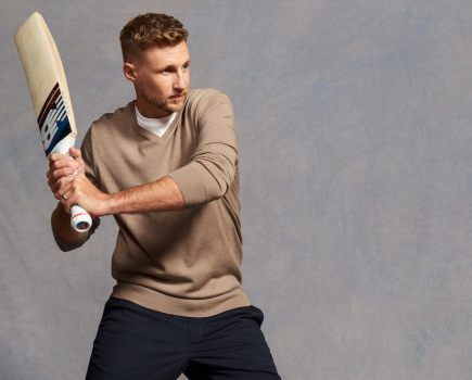 Joe Root poses with cricket bat