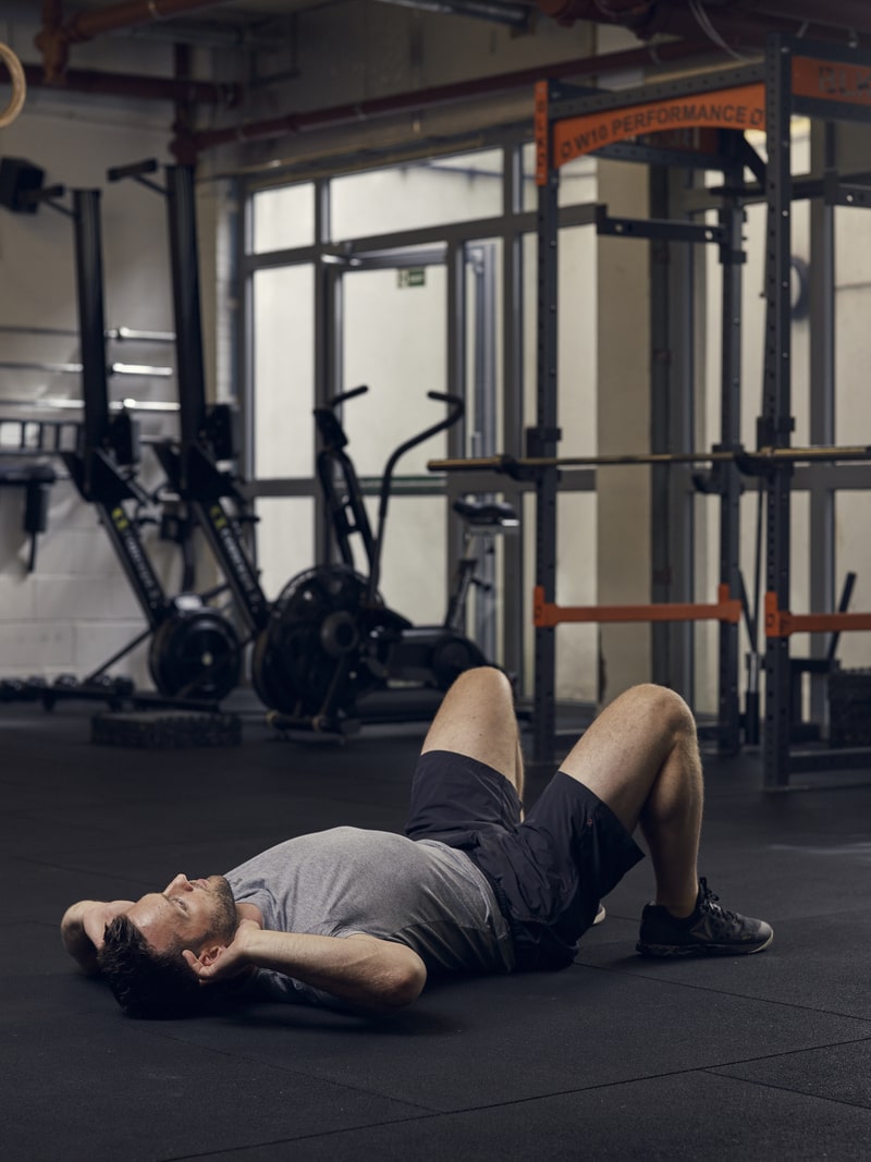 man demonstrates crunch, one of man demonstrates side plank, one of the best bodyweight exercises for core strength