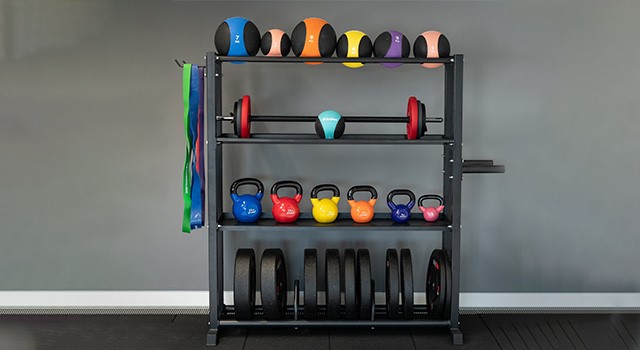 weights on a rack in a home gym