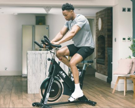 Man riding indoor exercise bike