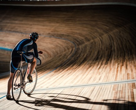 man track cycling in velodrome