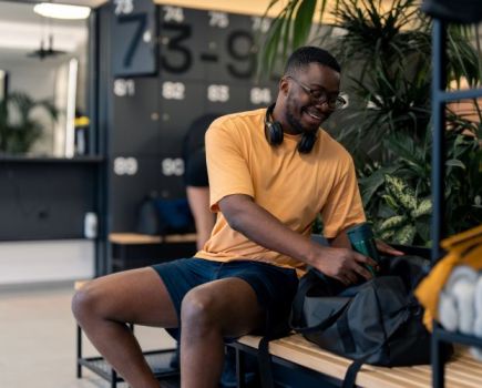 A man getting changed in gym locker-room