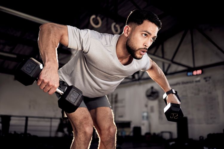 Close up of a man performing bent over row exercise