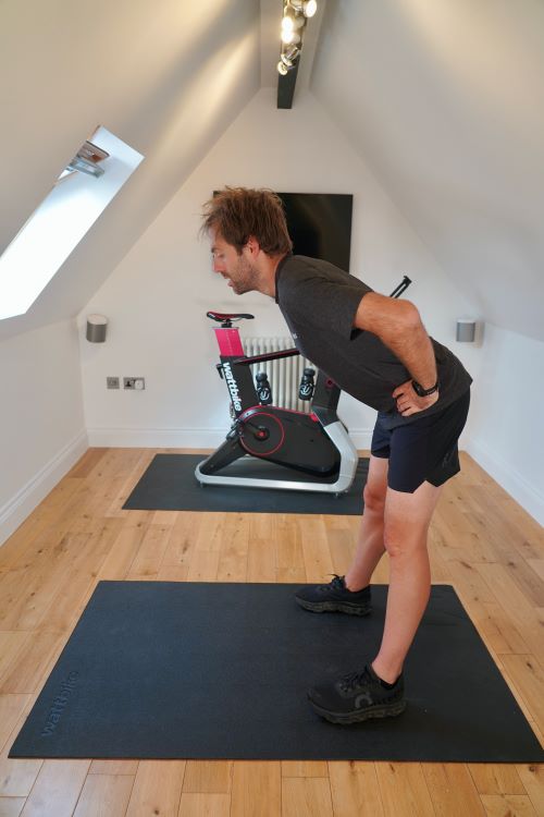 Man in home gym performing hip exercises