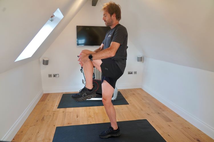 Man performing stretches in home gym