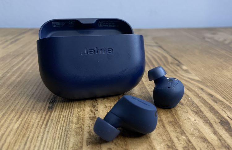 A pair of Jabra sports headphones and case on a table