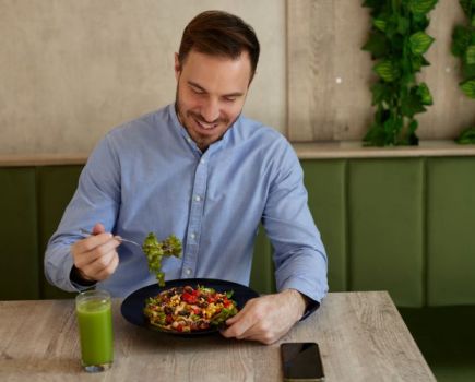 Man eating a healthy looking meal