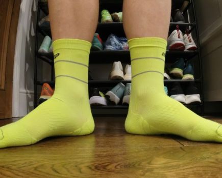 Close-up of a man's feet wearing running socks